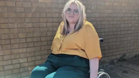 Lucy Earle using her wheelchair