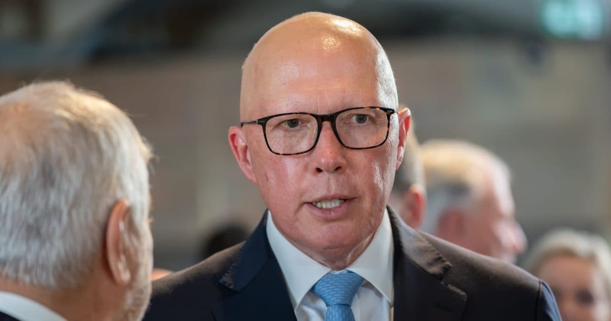 Conflicting Views on APS Job Cuts: Dutton vs. His Candidate